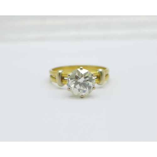 1059 - A solitaire diamond ring, approximately 3.3carat weight, set in yellow metal