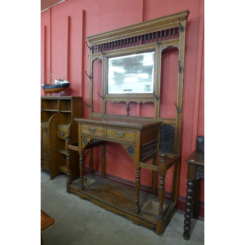 11 - A large Victorian Aesthetic Movement carved oak hallstand
