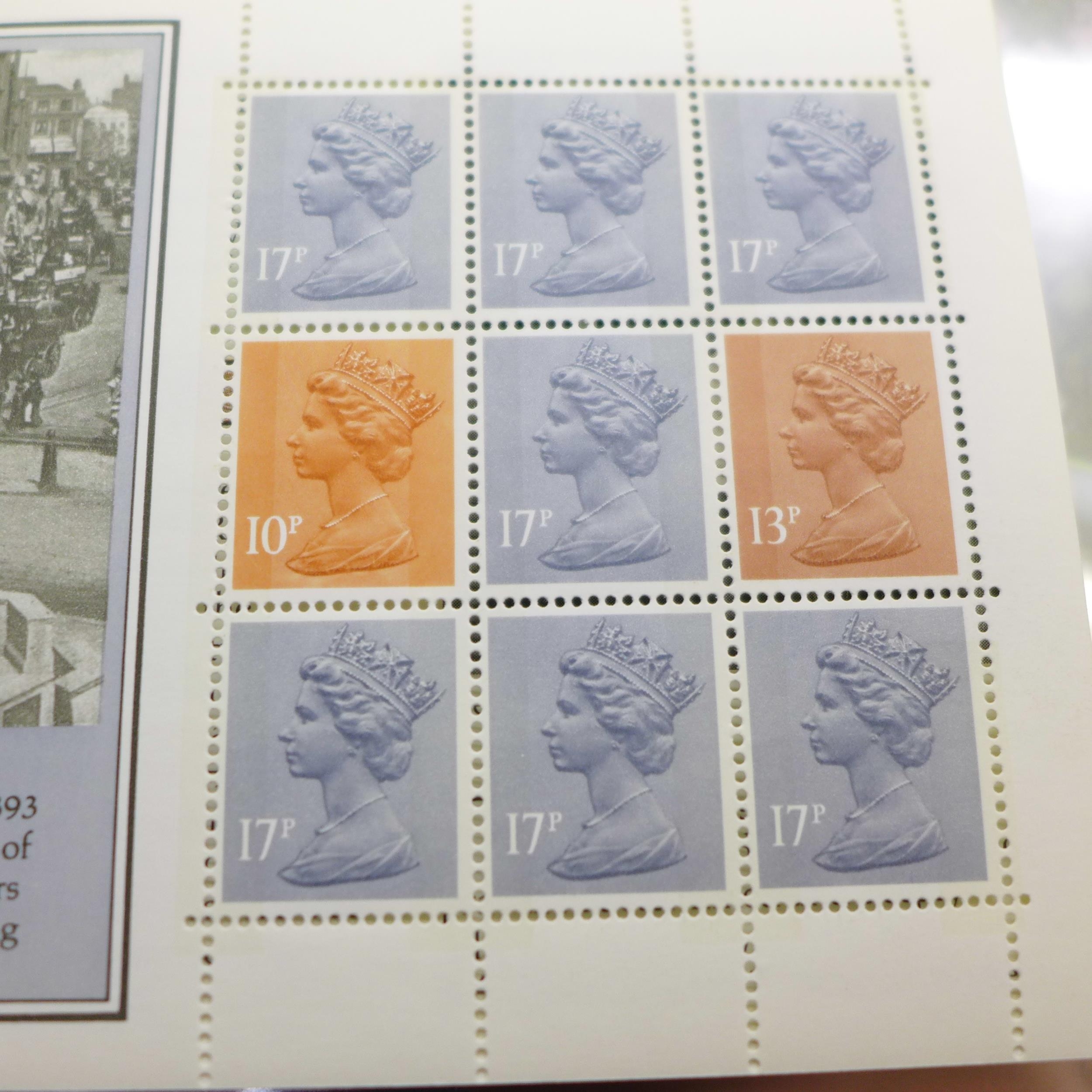 A folder of stamps and stamp booklets