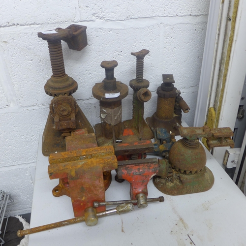 5 Assorted vintage bottle jacks and 2 vices Barnebys