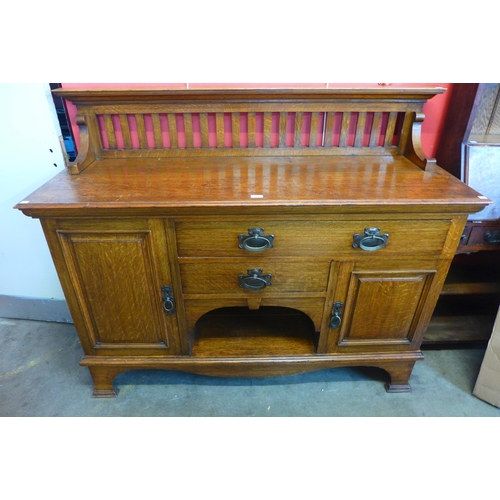 26 - An Arts and Crafts Maple & Co. Ltd. oak sideboard