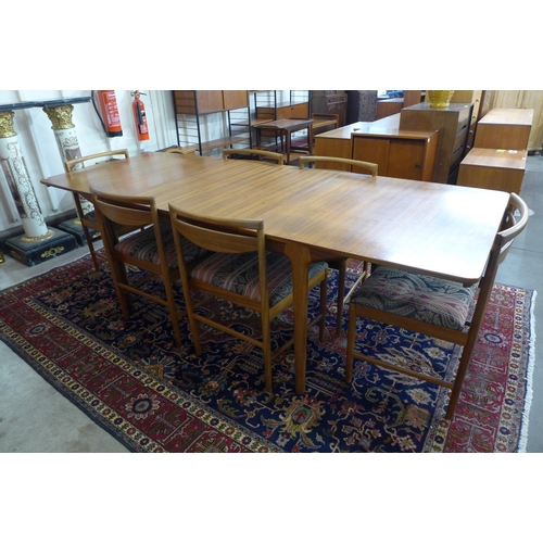 46 - A McIntosh teak T3 model double leaf extending dining table and six chairs