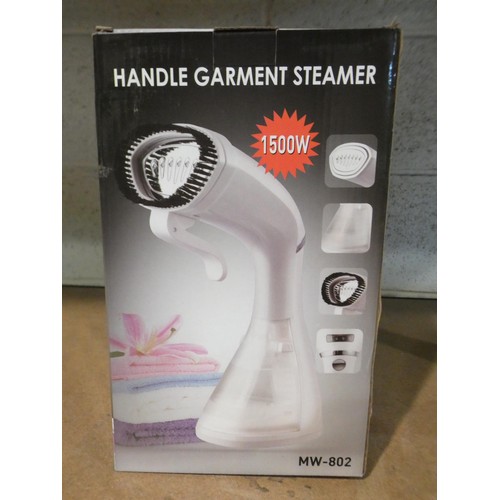 A white 1500w hand held garment steamer (model MW802) Barnebys