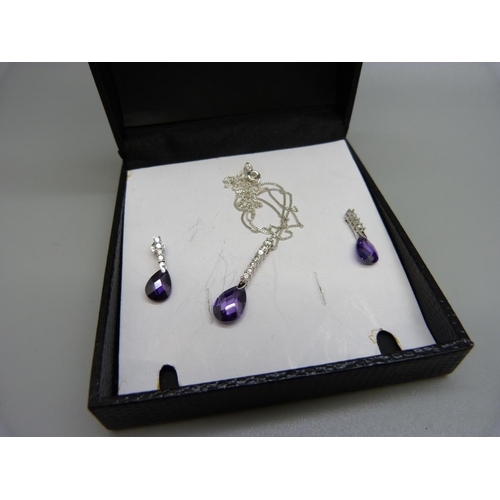985 - A silver and amethyst pendant and three other pendants and chains