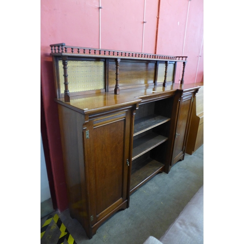 33 - A Victorian Aesthetic Movement walnut breakfront bookcase