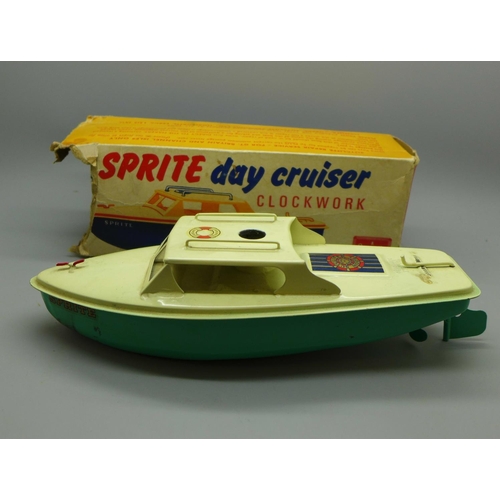 612 - A Sutcliffe model tin-plate Sprite Day Cruiser with key, boxed