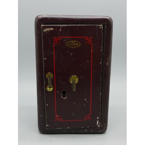 623 - A Chubb miniature advertising money box in the form of a safe, with key, 11cm