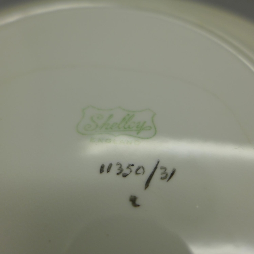 637 - A Shelley Vincent trio of cup, saucer and side plate, serial number 11350/31, side plate a/f (crack)