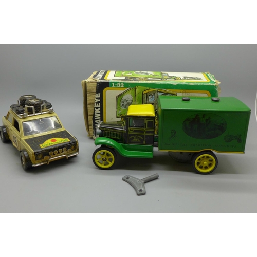 639 - A John Deere Hawkeye clockwork truck, boxed and a Fiat Africa Safari 4x4 model vehicle
