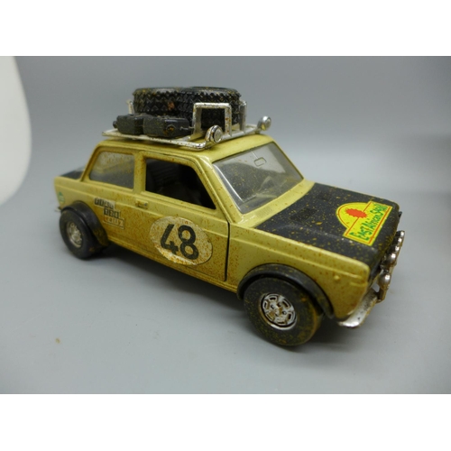 639 - A John Deere Hawkeye clockwork truck, boxed and a Fiat Africa Safari 4x4 model vehicle