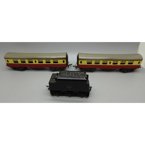 647 - Two Tri-ang 00 gauge model railway carriages and a coal wagon