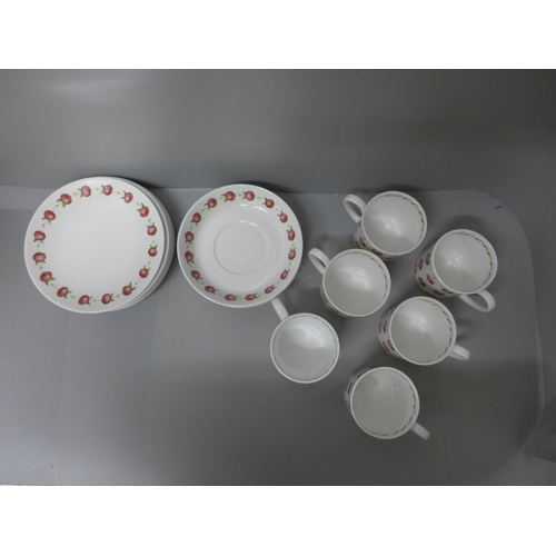 655 - A Susie Cooper Apple Gay set of six cups, saucers and tea plates