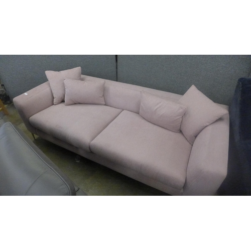 1323 - A sherbet pink velvet three seater sofa