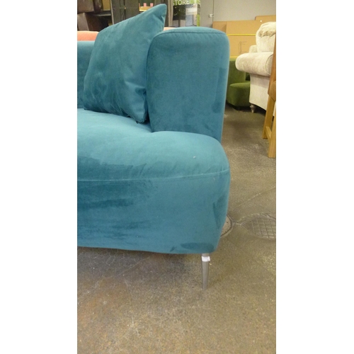 1324 - A Turquoise velvet three seater sofa, damage to back right leg