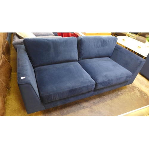 1325 - A blue velvet three seater sofa
