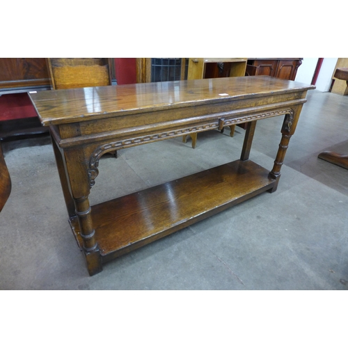 13 - A 17th Century style carved Ipswich oak serving table