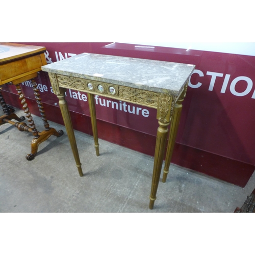 17 - A small French gilt wood and fossil marble topped console table