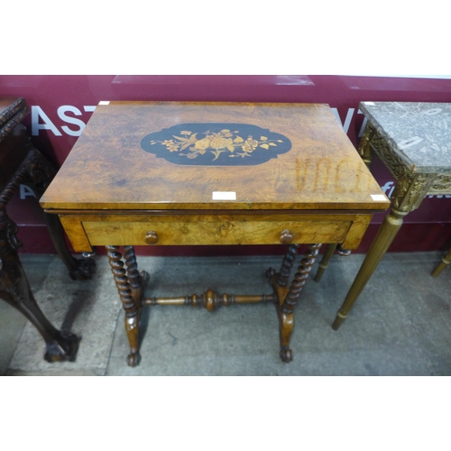 18 - A Victorian inlaid walnut games table