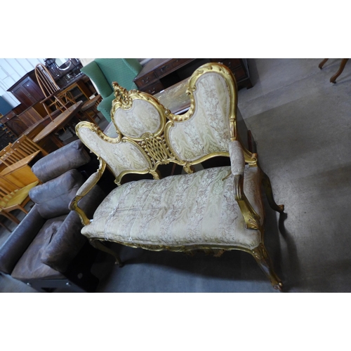 37 - A French Louis XV style giltwood canape settee