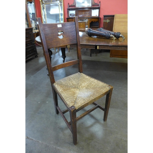 41 - A Liberty & Co. style Arts and Crafts oak rush seated side chair