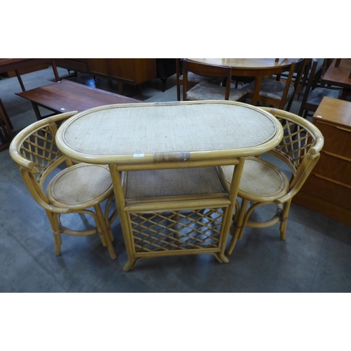 60 - A bamboo and rattan table and two chairs