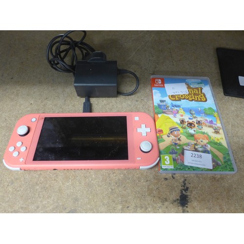 Nintendo Switch in light coral pink with charger and 2 games - W