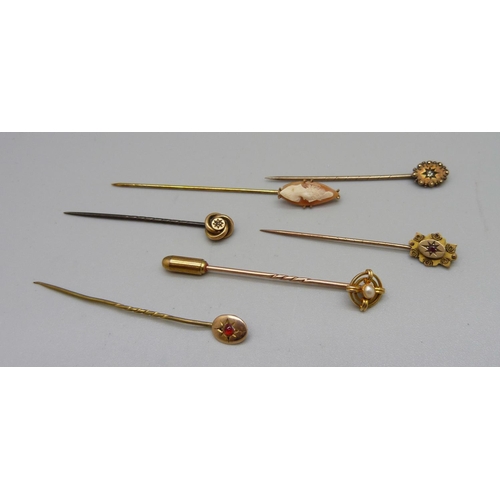 Six stick pins; one 15ct and pearl, one pin marked 10k, one with Chester mark and three others
