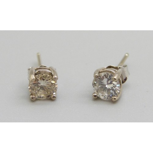 957 - A pair of 18ct gold and diamond ear studs, approximately 0.90 total carat weight