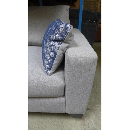 1411 - A grey upholstered three seater sofa