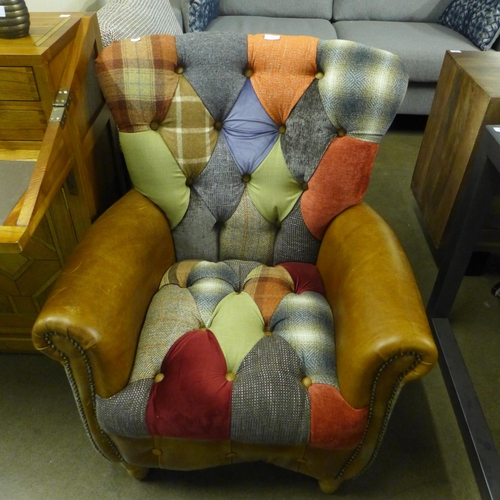 1408 - A Fast Track Harlequin patchwork and cerato leather armchair - damaged bottom frame