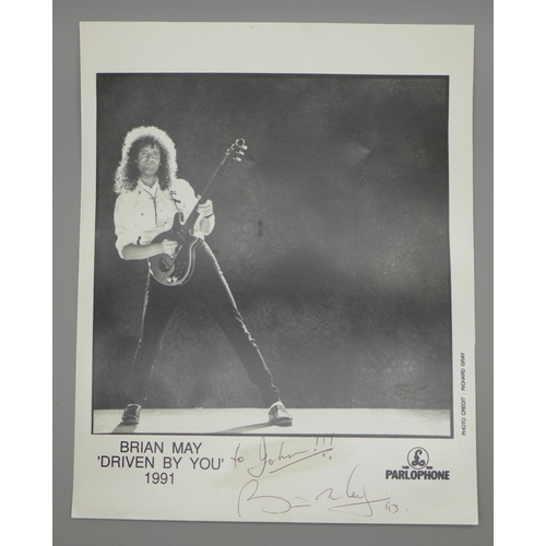 618 - A Queen related autographed Parlophone promotional photograph of Brian May