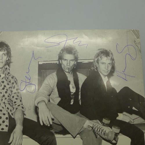 619 - Pop music; a Police autographed photograph