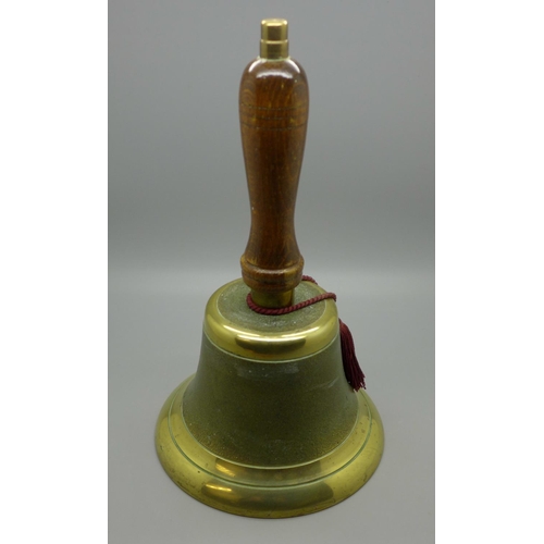 623 - A brass hand bell with wooden handle