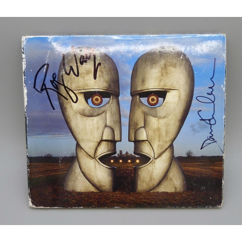 646 - A Pink Floyd autographed CD, The Division Bell signed by David Gilmour and Roger Waters