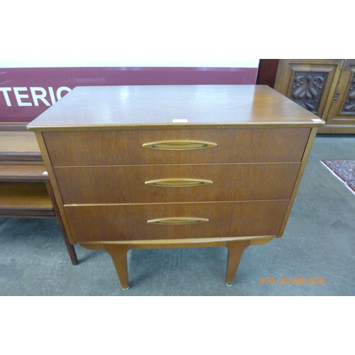 23 - A Jentique teak metamorphic desk/chest of drawers