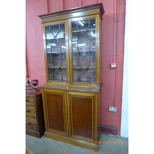 4 - An Edward VII inlaid mahogany bookcase