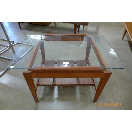 50 - A teak and glass topped coffee table