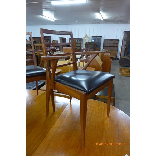 56 - A McIntosh teak extending dining table and six chairs