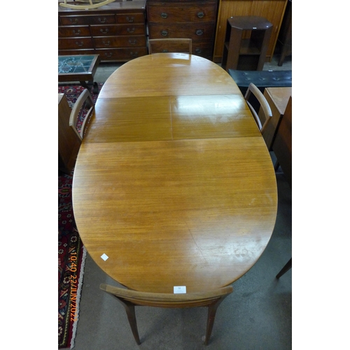 56 - A McIntosh teak extending dining table and six chairs