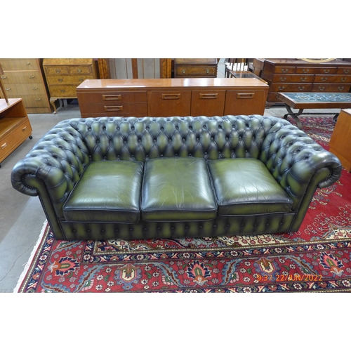 6 - A green leather Chesterfield settee