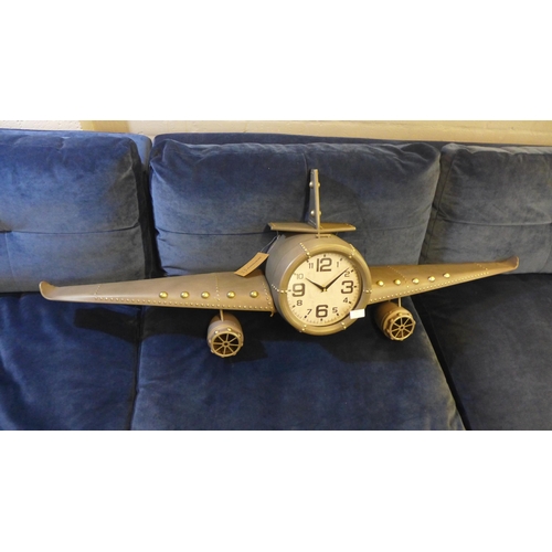1325 - An aeroplane style wall clock with a wing span of 143cms (PHLL31049)   #