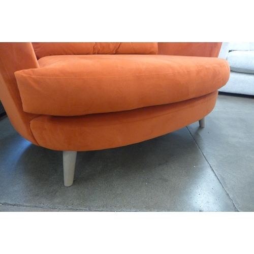 1345 - A tangerine velvet upholstered love seat