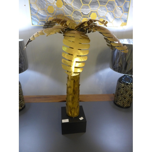 A gold ornamental palm tree