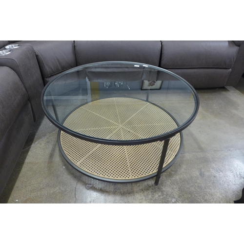 1362 - A circular coffee table with rattan shelf and glass top (minor damage to rattan)