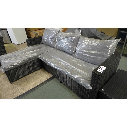 3054 - 3-piece Black rattan corner sofa set with grey cushions and glass topped coffee table * This lot is ... 