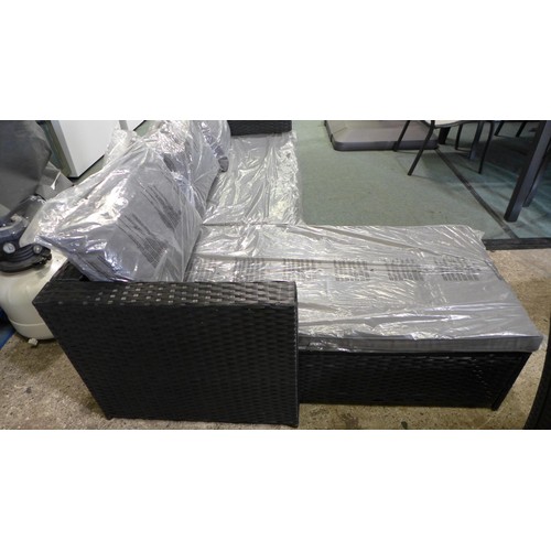 3055 - 3-piece Black rattan corner sofa set with grey cushions and glass topped coffee table * This lot is ... 