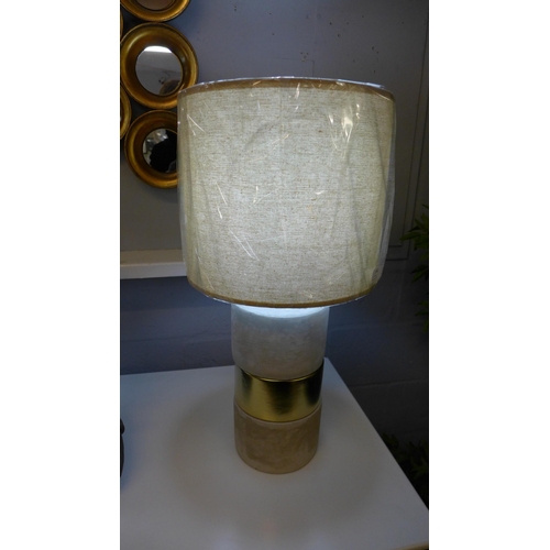 1327 - A concrete base table lamp with a decorative gold band and linen shade, H 63cms (70316743)   #