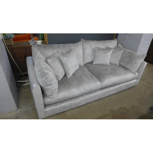 1348 - A grey crushed velvet upholstered three seater sofa