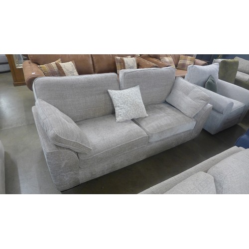 1351 - A grey upholstered pinched back three seater sofa