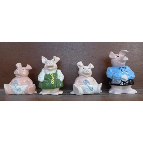 603 - Four Nat West pig money banks; Mum, Sister and two Babies